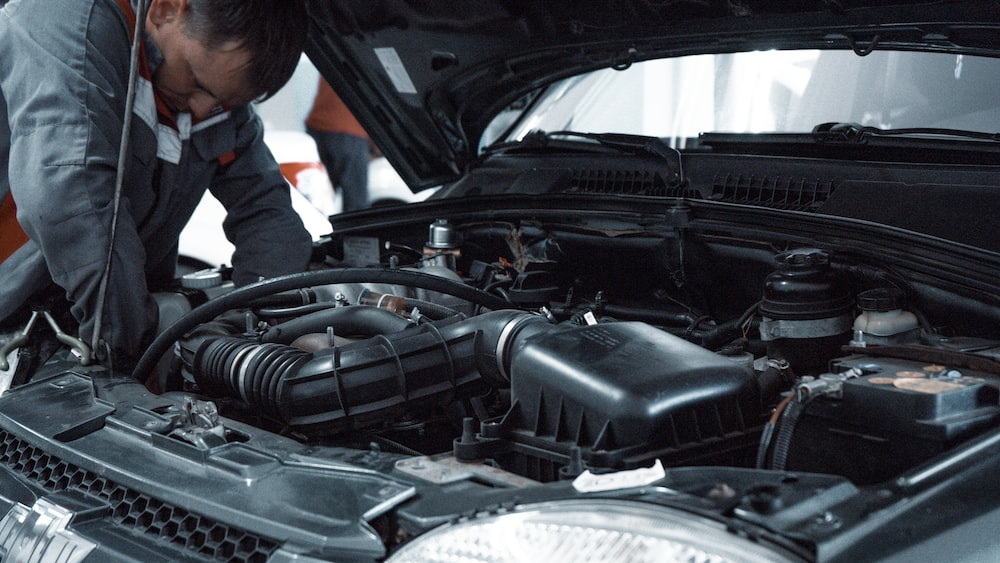 A car’s engine undergoing inspection post-accident.