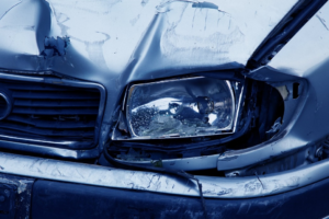 Damaged hood of a car following an accident.