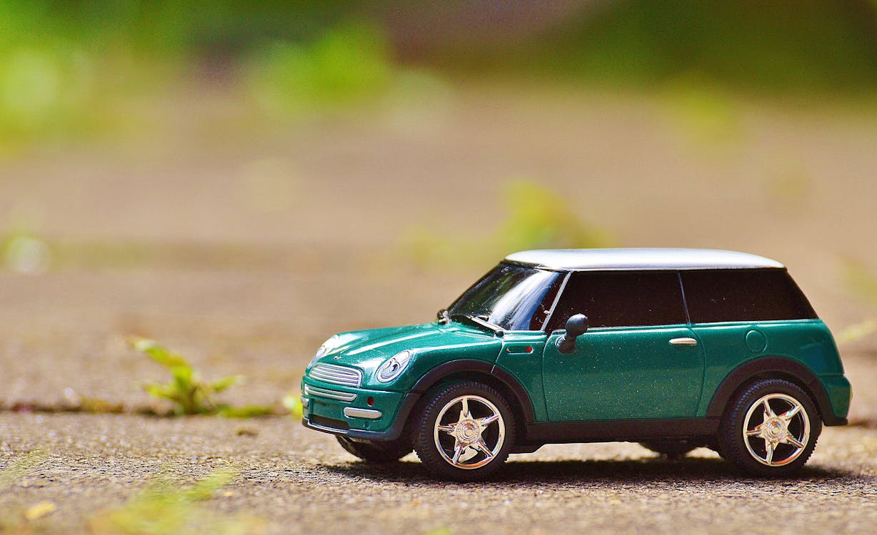 a toy car on the pavement