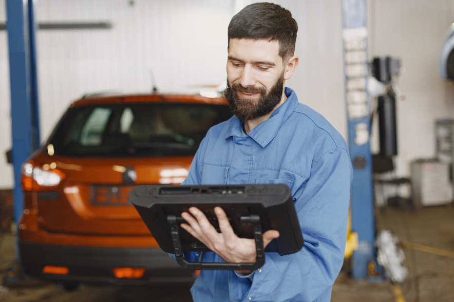 a car mechanic with a tablet