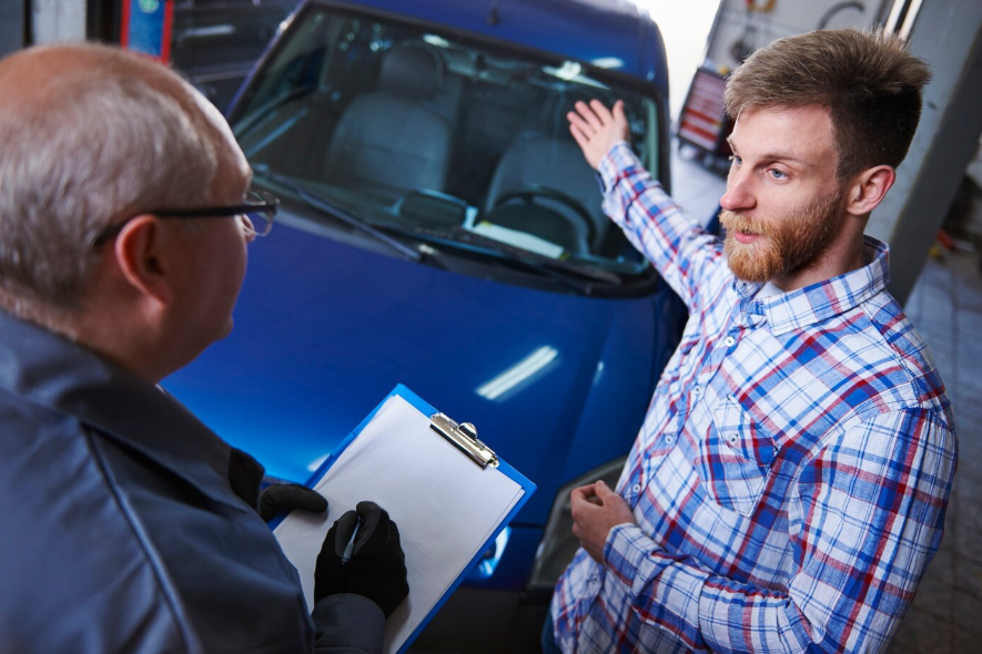 a customer talking with mechanic