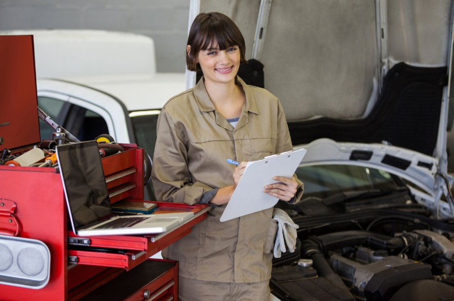 a female mechanic preparing a checklist