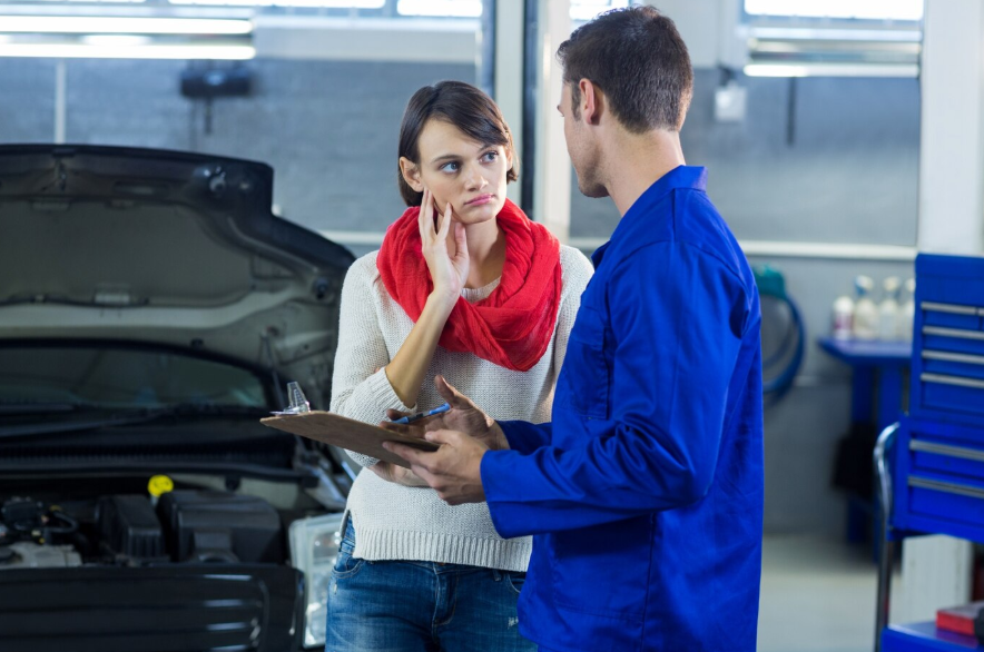 a mechanic showing list to customer