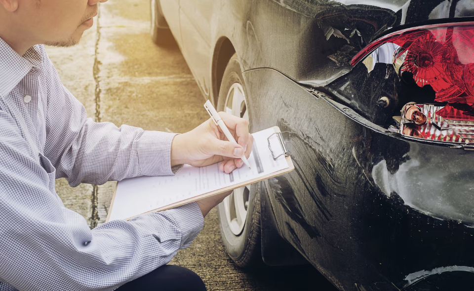 an insurance agent working on a car accident claim process